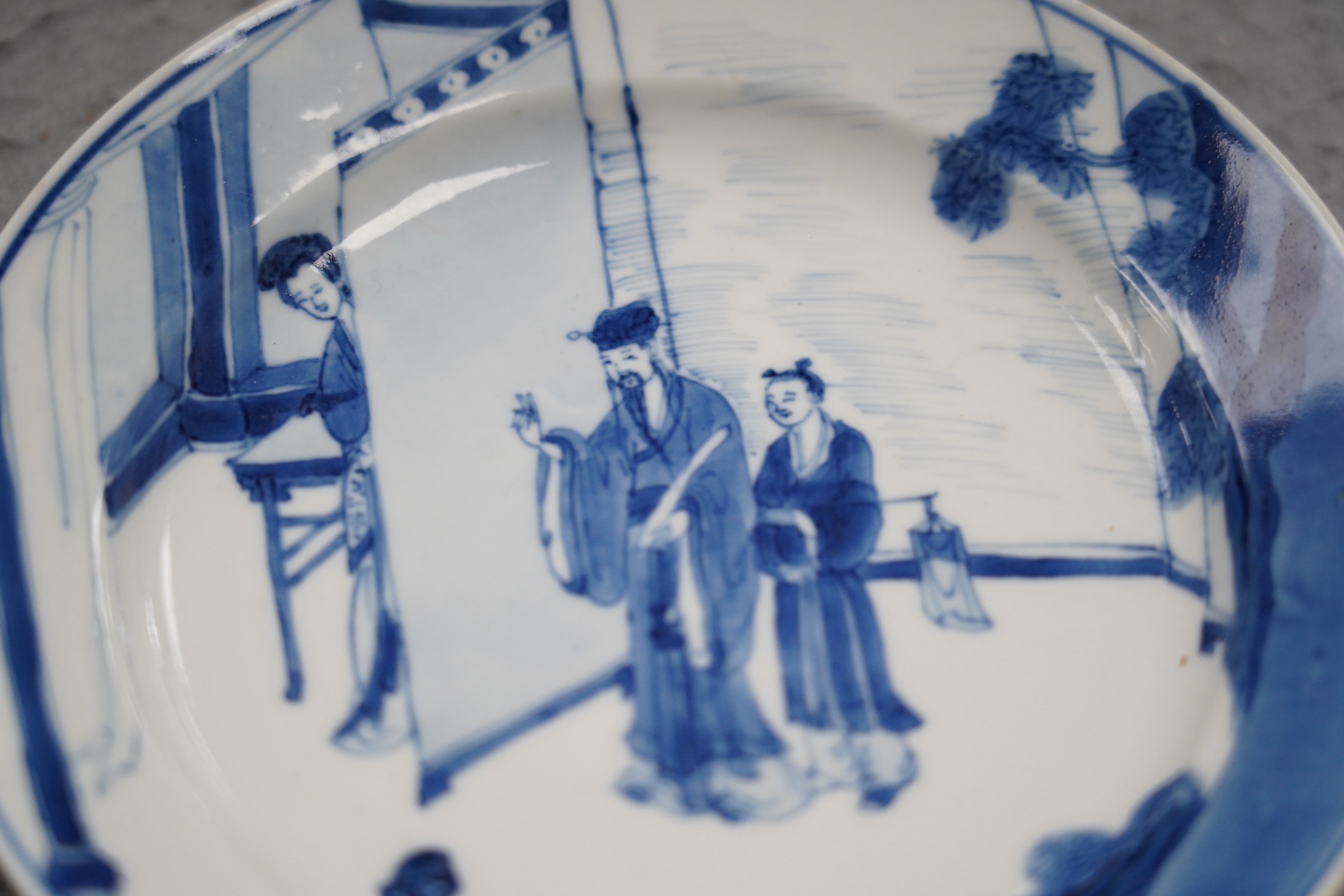 A pair of Chinese blue and white small plates, Kangxi period, hairline cracks to one plate.